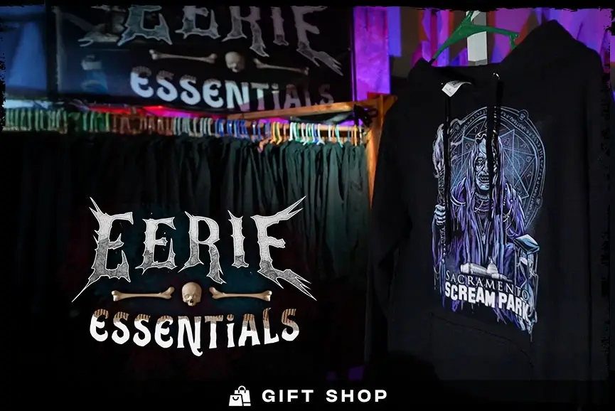A black hoodie with the Sacramento Scream Park logo hangs at this outdoor gift shop.