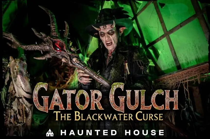 Gator Gulch: The Blackwater Curse Scare actor holding a cursed swamp staff in the Gator Gulch haunted house at Sacramento Scream Park.